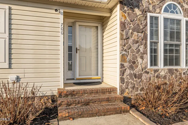 a view of a house with a door and a window