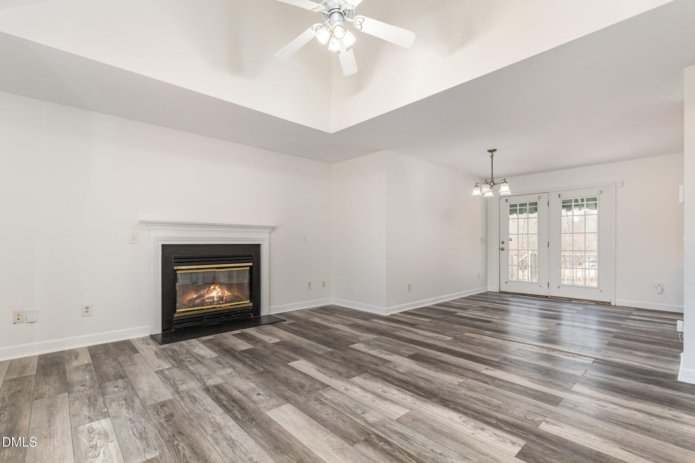 700 Thompson Road Graham, NC 27253 - Photo 4 of 34 an empty room with windows and fireplace