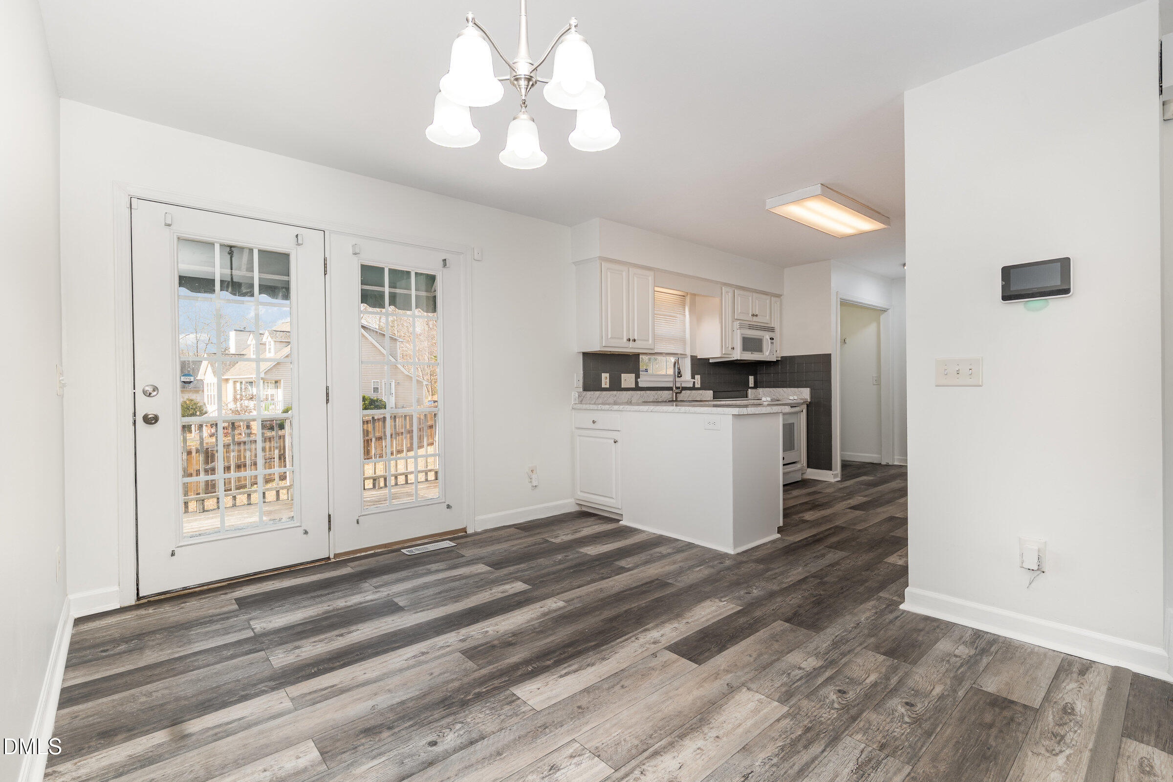 700 Thompson Road Graham, NC 27253 - Photo 8 of 34 a kitchen with stainless steel appliances a stove top oven and a refrigerator