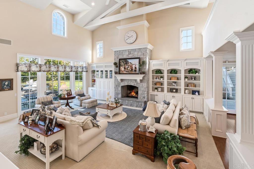 3056 Wildflower Drive Encinitas, CA 92024 - Photo 16 of 56 a living room with furniture fireplace and a flat screen tv