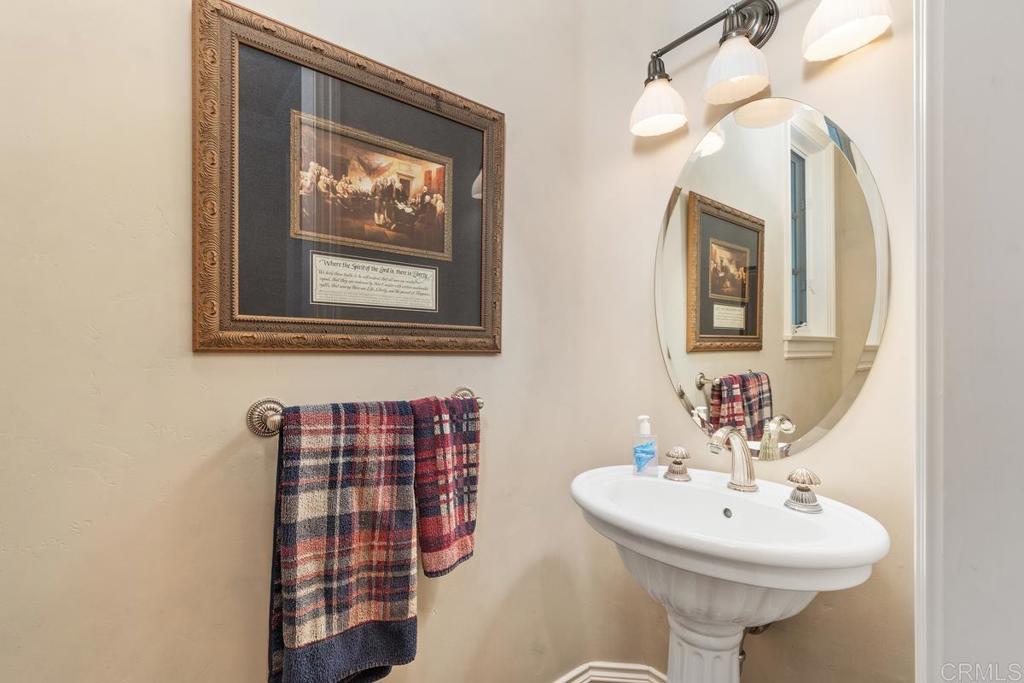 3056 Wildflower Drive Encinitas, CA 92024 - Photo 28 of 56 a bathroom with a sink and a mirror