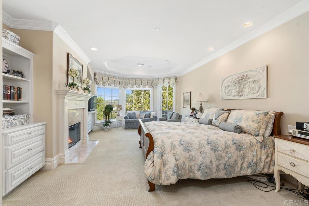 3056 Wildflower Drive Encinitas, CA 92024 - Photo 34 of 56 a spacious bedroom with a bed and a couch