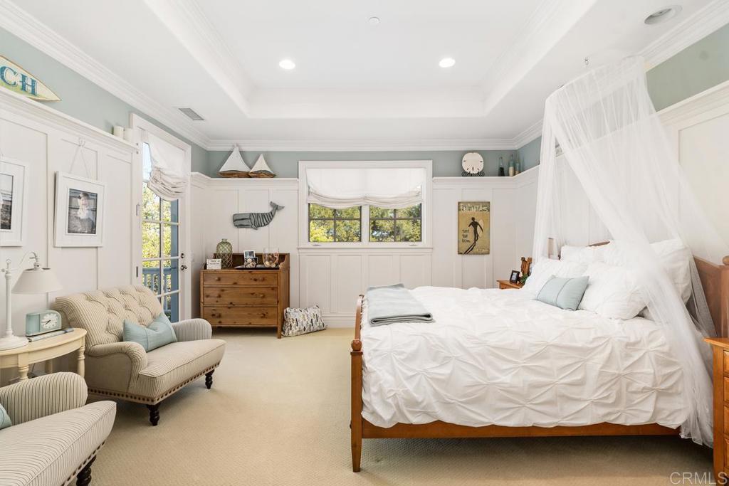 3056 Wildflower Drive Encinitas, CA 92024 - Photo 40 of 56 a bedroom with a bed couch and window