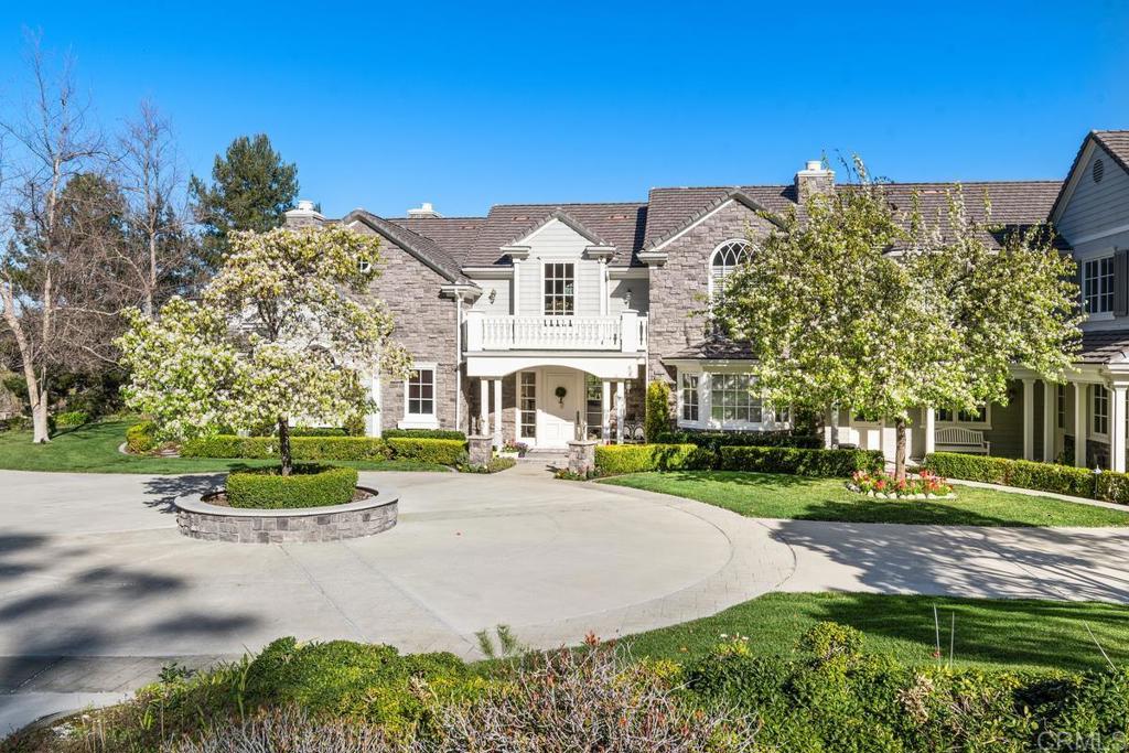 3056 Wildflower Drive Encinitas, CA 92024 - Photo 8 of 56 a white house with a big yard and large trees