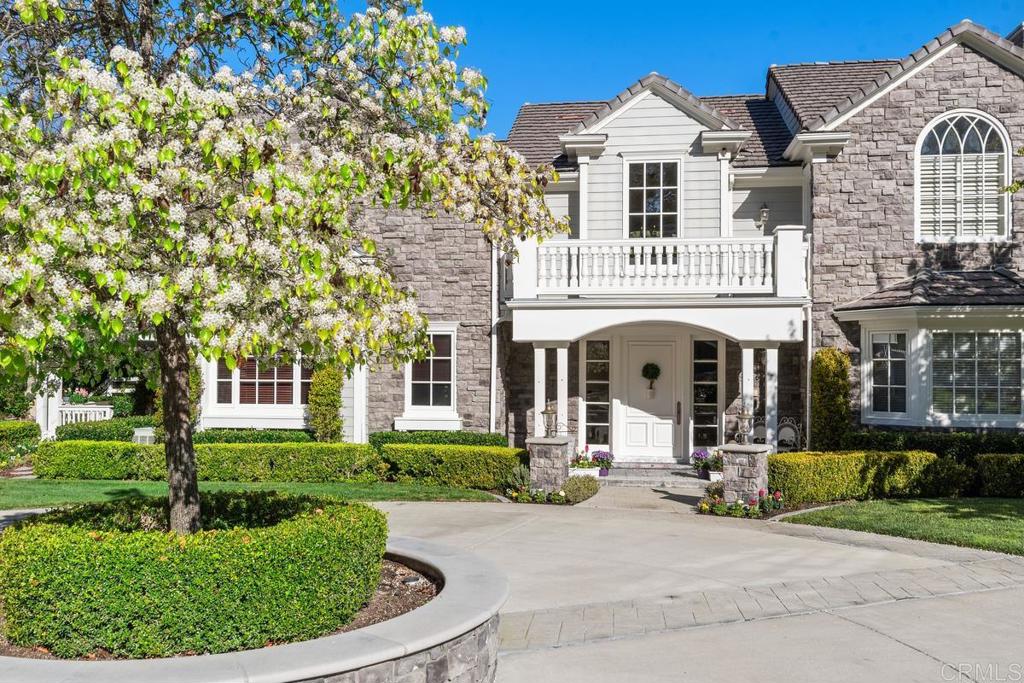 3056 Wildflower Drive Encinitas, CA 92024 - Photo 9 of 56 a front view of a house with a garden