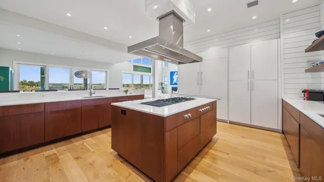 a kitchen with granite countertop a sink and a stove