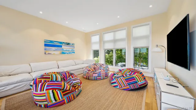 a bedroom with furniture and a flat screen tv