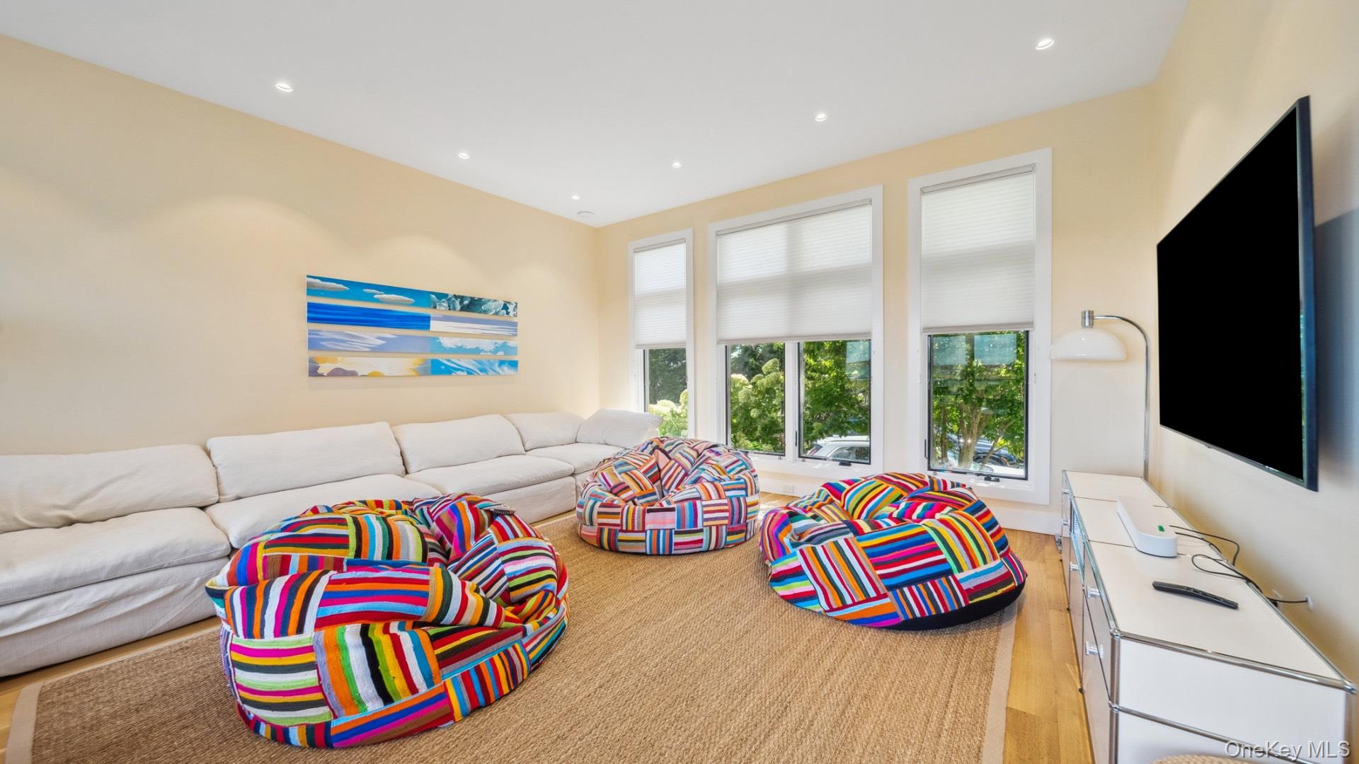 102-92 Dune Road Westhampton Beach, NY 11978 - Photo 16 of 40 Living room with recessed lighting and light wood finished floors