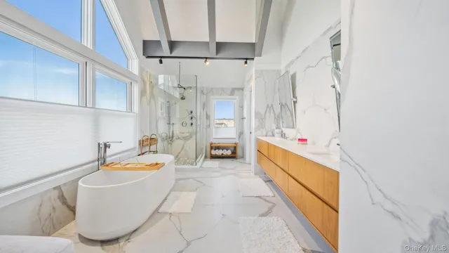 a bathroom with a bathtub and sink