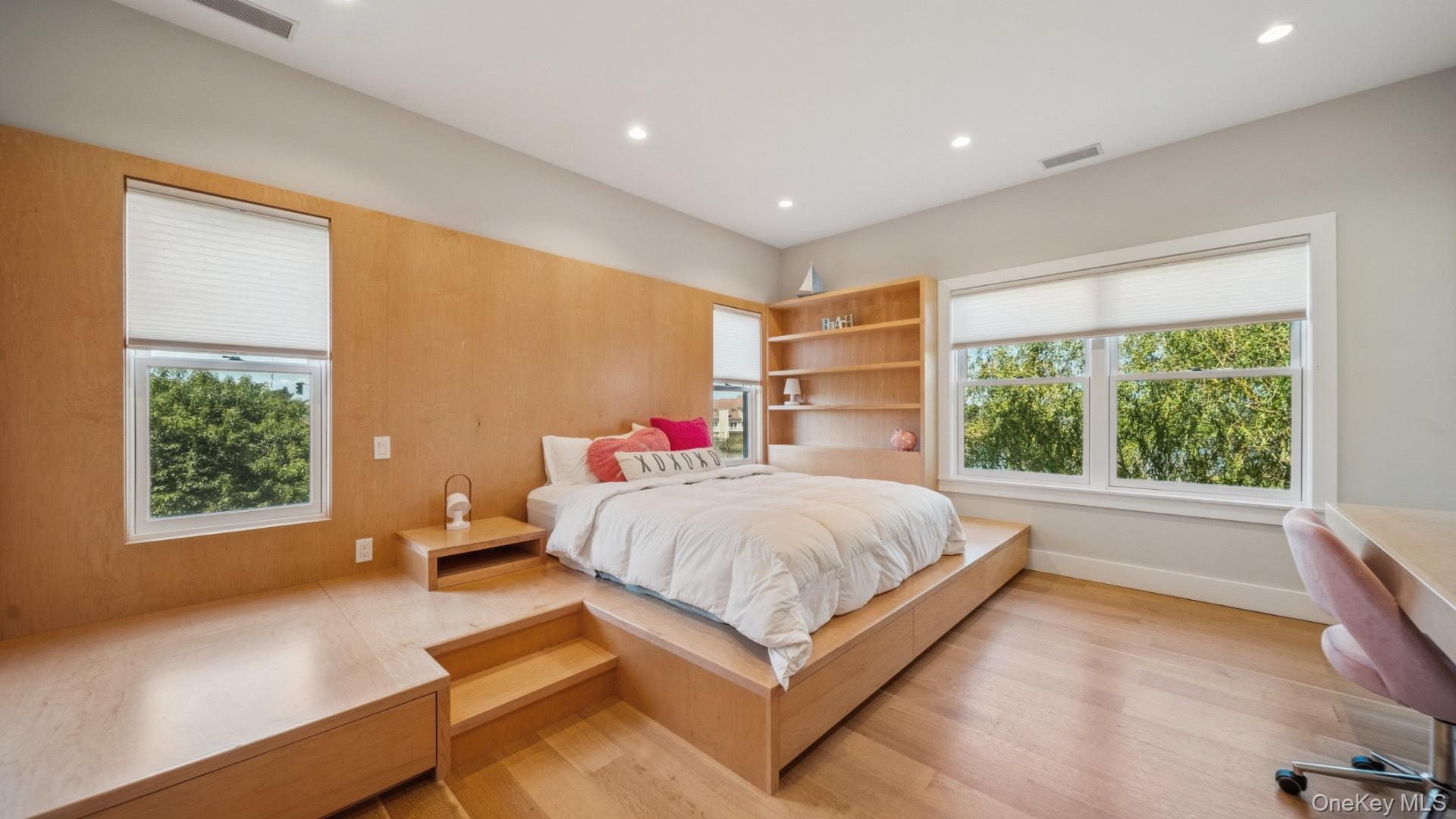 102-92 Dune Road Westhampton Beach, NY 11978 - Photo 27 of 40 Bedroom with a desk, recessed lighting, multiple windows, and light wood-type flooring