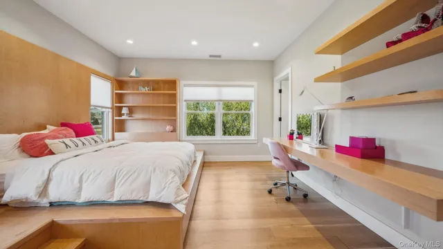 a bedroom with a bed and window