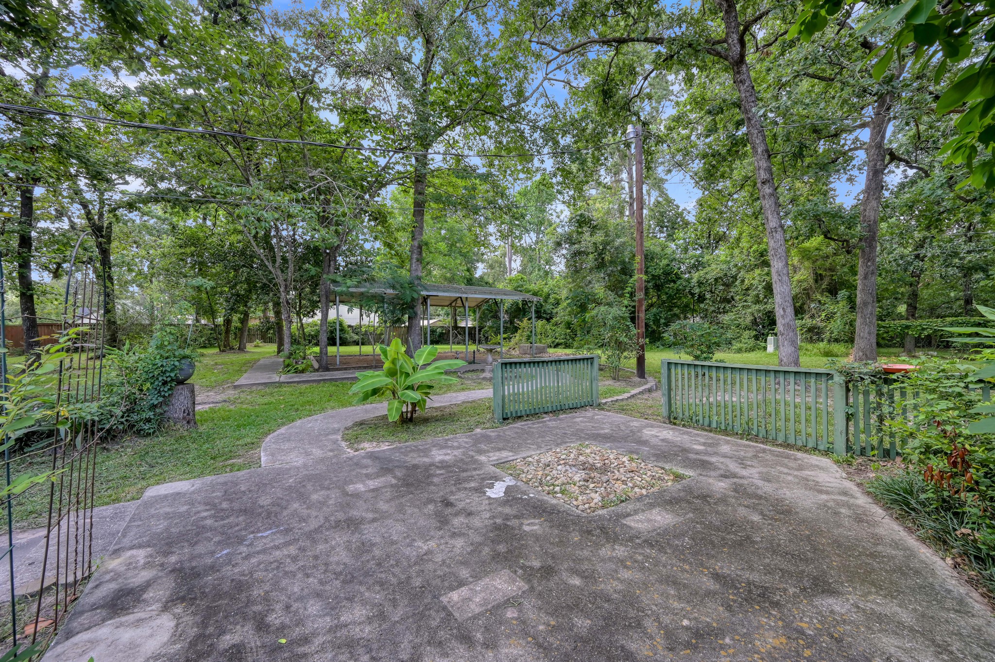 2207 Arendale Lane Spring, TX 77386 - Photo 2 of 30 Rear elevation showcasing the patio and covered outdoor entertaining area with views of the spacious backyard.