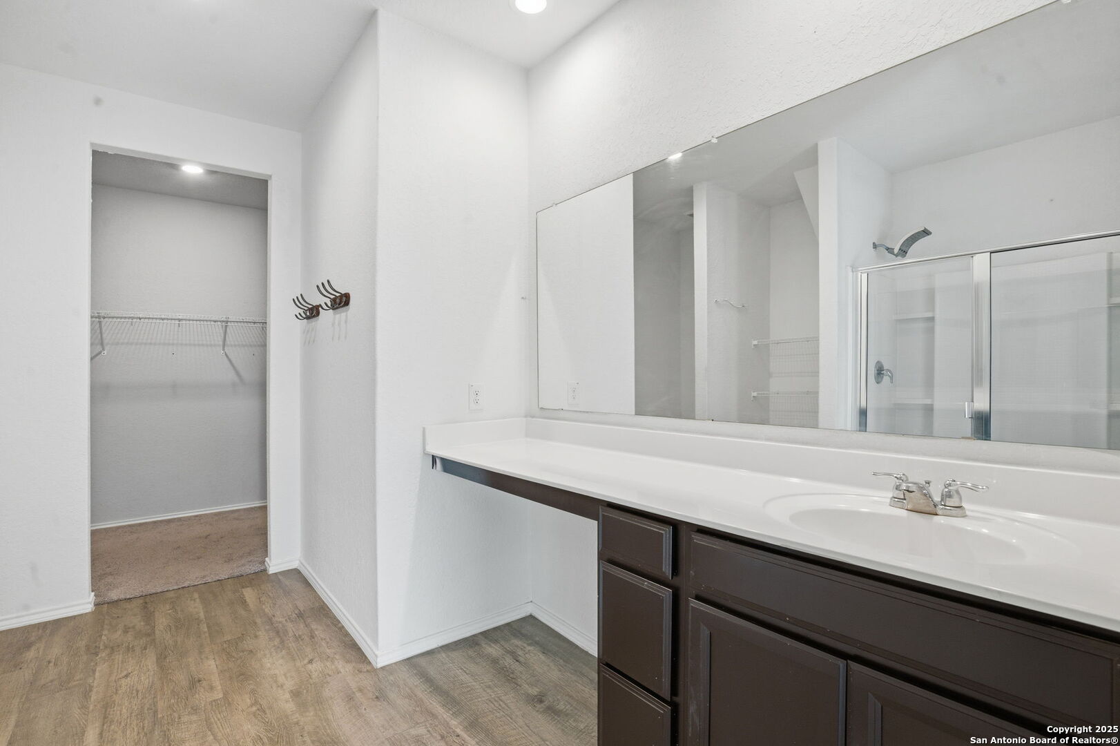 7338 Storm Moon Converse, TX 78109 - Photo 14 of 31 a bathroom with a sink double vanity and a mirror