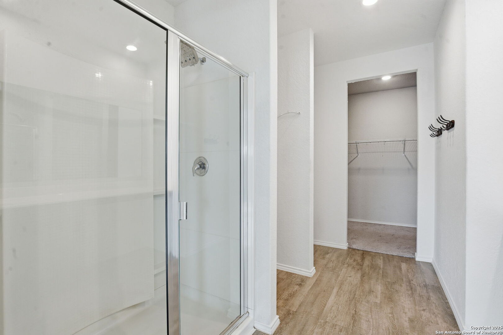 7338 Storm Moon Converse, TX 78109 - Photo 15 of 31 a bathroom with a shower and a glass door