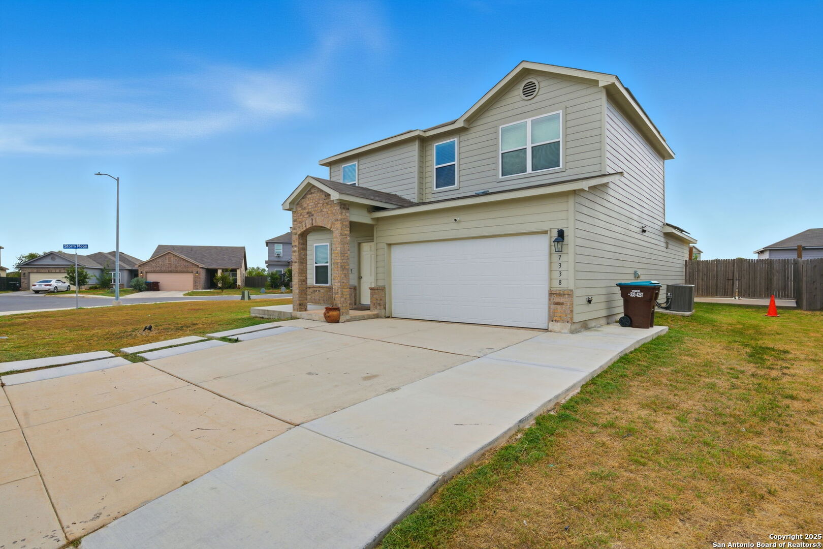 7338 Storm Moon Converse, TX 78109 - Photo 2 of 31 a front view of a house with a yard