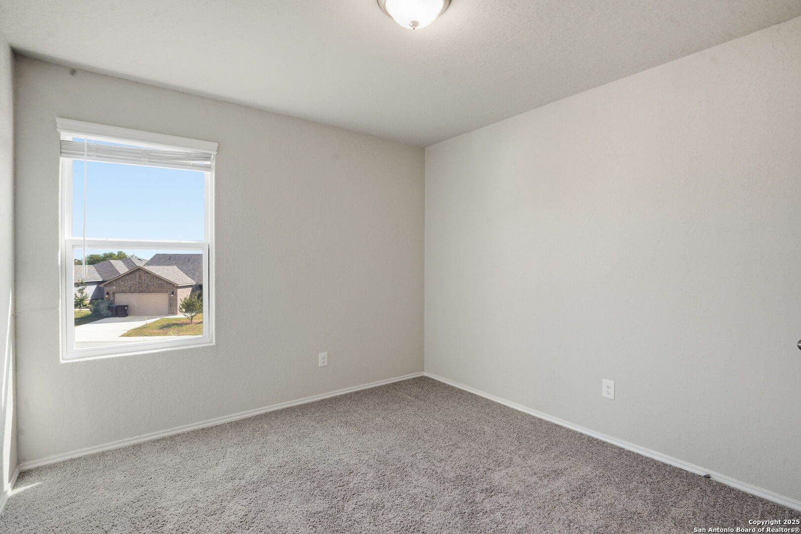 7338 Storm Moon Converse, TX 78109 - Photo 22 of 31 an empty room with a window
