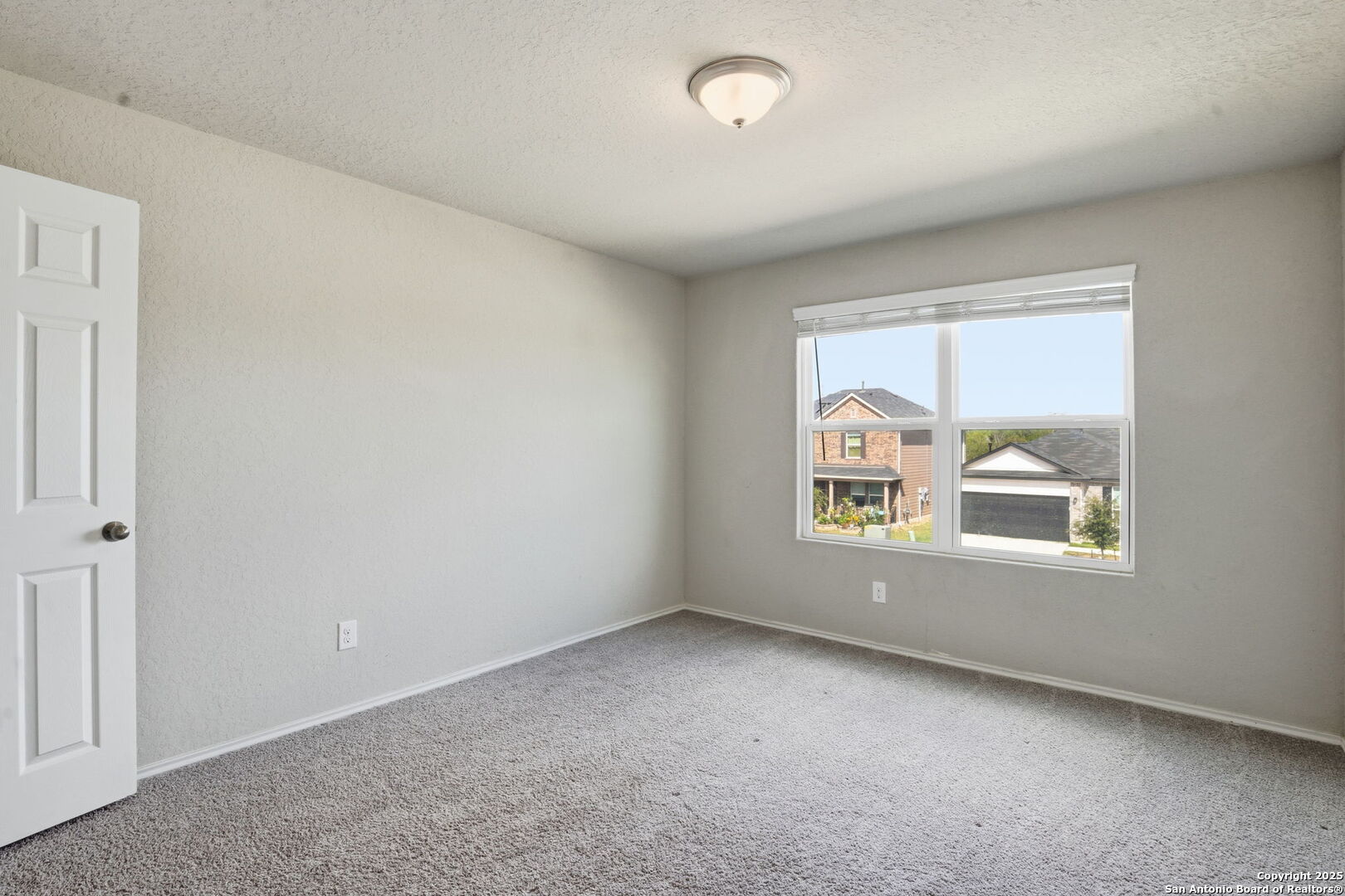 7338 Storm Moon Converse, TX 78109 - Photo 25 of 31 an empty room with a window