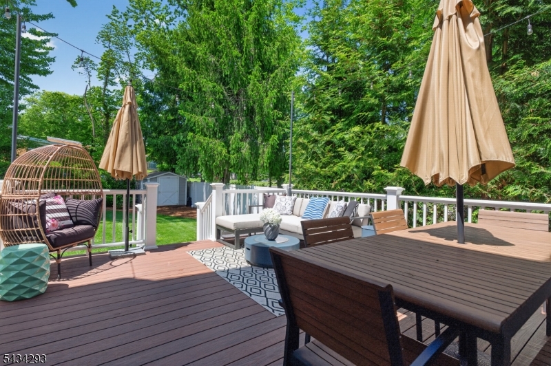 921 Harding Street Westfield, NJ 07090 - Photo 45 of 50 a wooden deck with a table and chairs