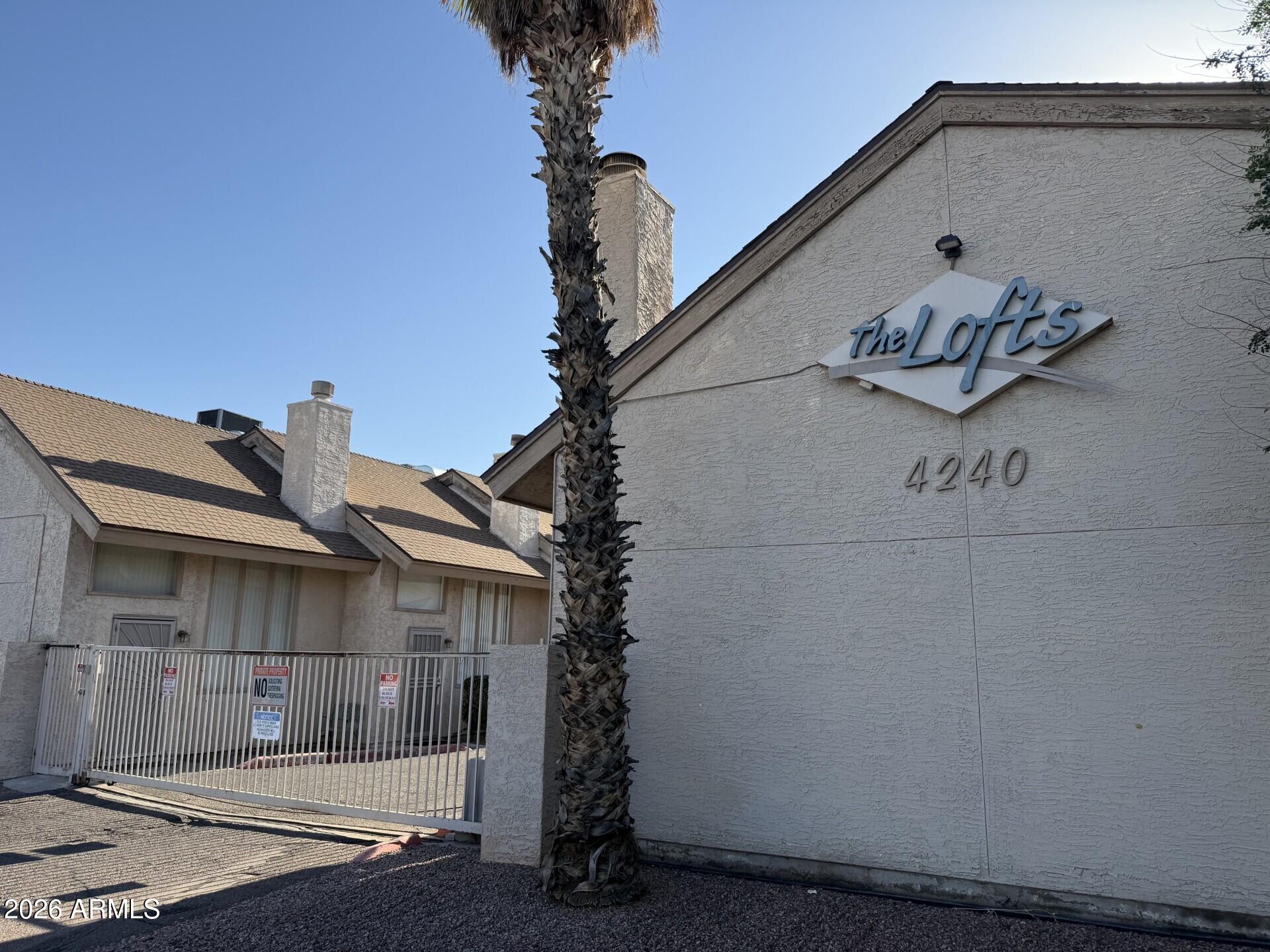 4240 North Longview Avenue, Unit 9 Phoenix, AZ 85014 - Photo 11 of 13 a front view of a house with garage