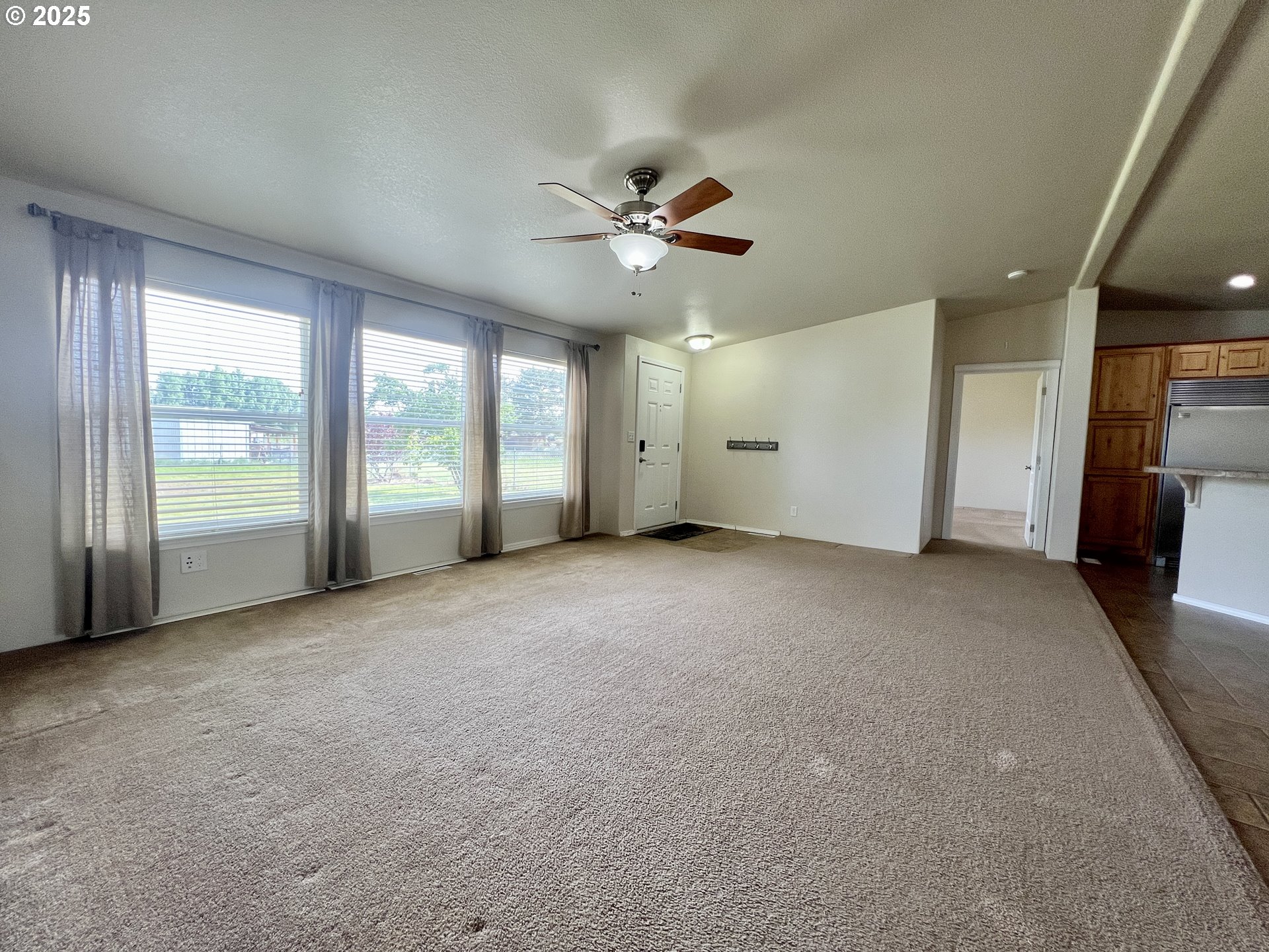 81631 West 8th Road Irrigon, OR 97844 - Photo 8 of 28 a view of a livingroom with a ceiling fan and window