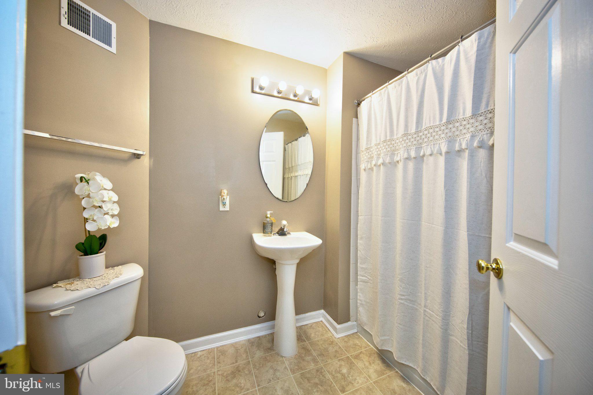 23 Caterham Court Rosedale, MD 21237 - Photo 22 of 27 Serene bathroom with elegant touches.