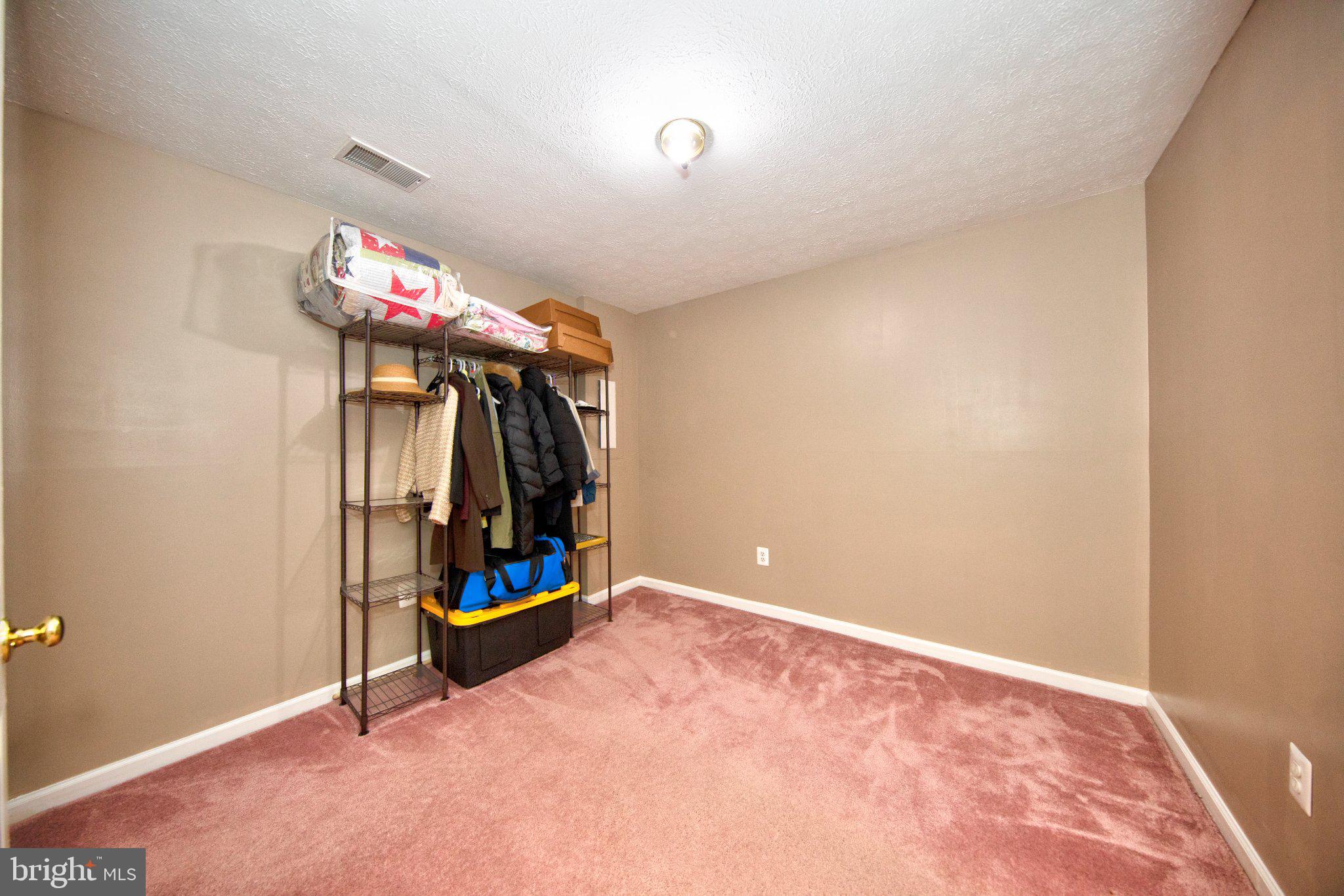 23 Caterham Court Rosedale, MD 21237 - Photo 23 of 27 Cozy room with soft carpeted floors.
