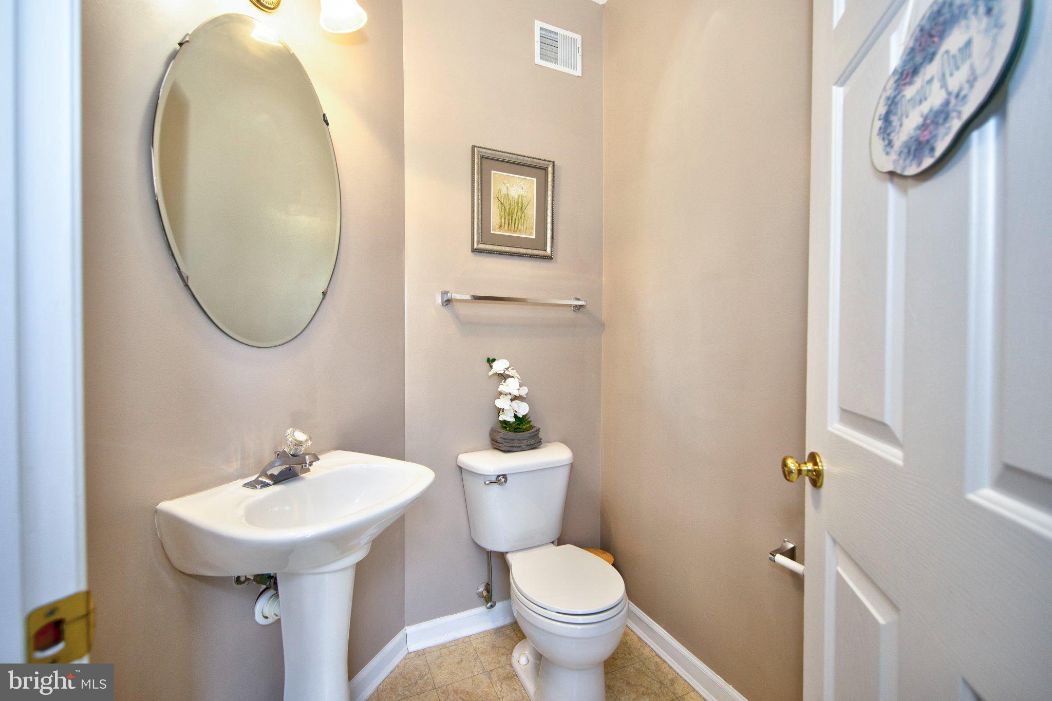 23 Caterham Court Rosedale, MD 21237 - Photo 6 of 27 Charming powder room with elegant touches.
