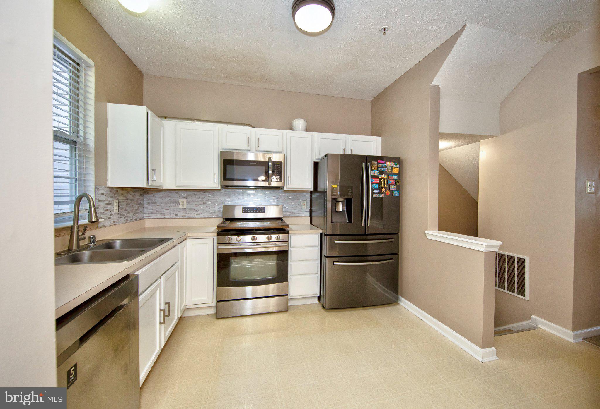 23 Caterham Court Rosedale, MD 21237 - Photo 9 of 27 Modern kitchen with sleek finishes.