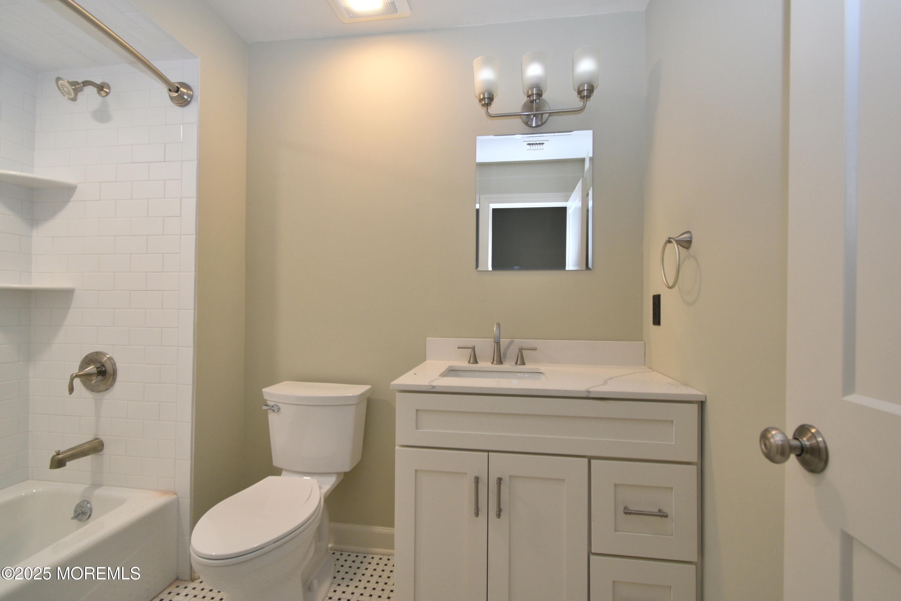 324 A Broad Street Keyport, NJ 07735 - Photo 18 of 19 a bathroom with a sink toilet a mirror and shower