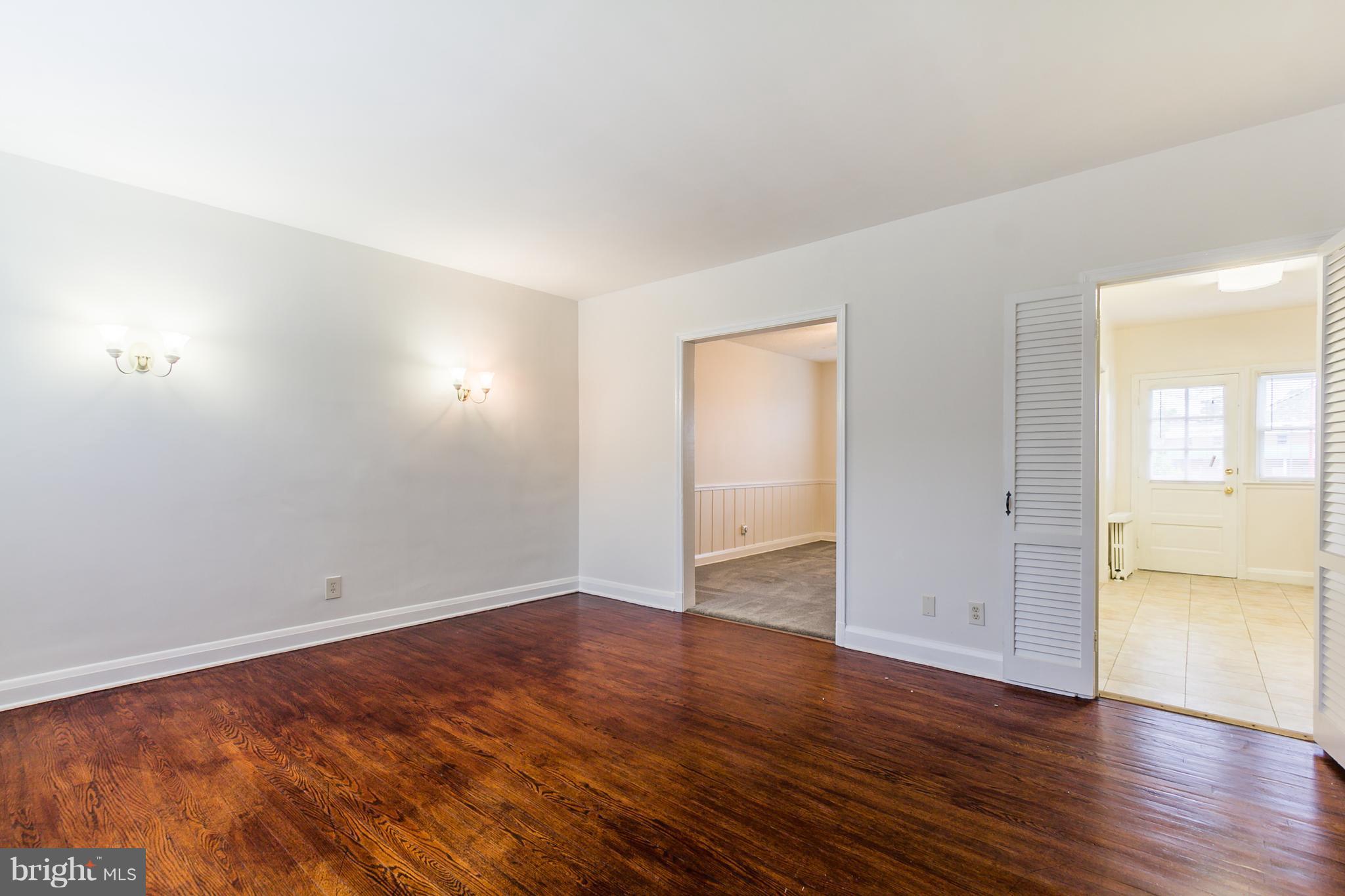 5228 Old Frederick Road Baltimore, MD 21229 - Photo 2 of 28 wooden floor in an empty room