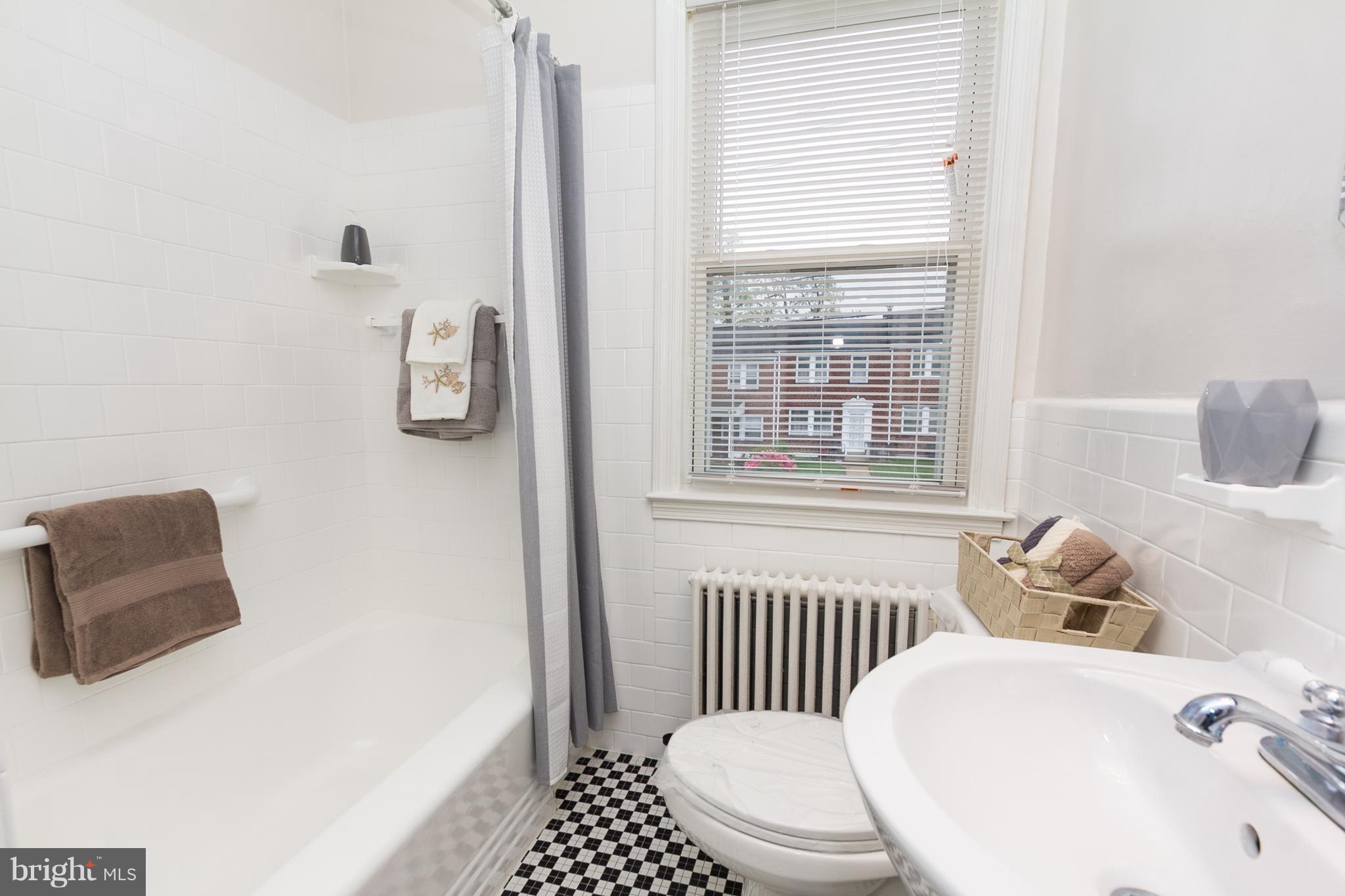 5228 Old Frederick Road Baltimore, MD 21229 - Photo 18 of 28 a bathroom with a sink and a toilet