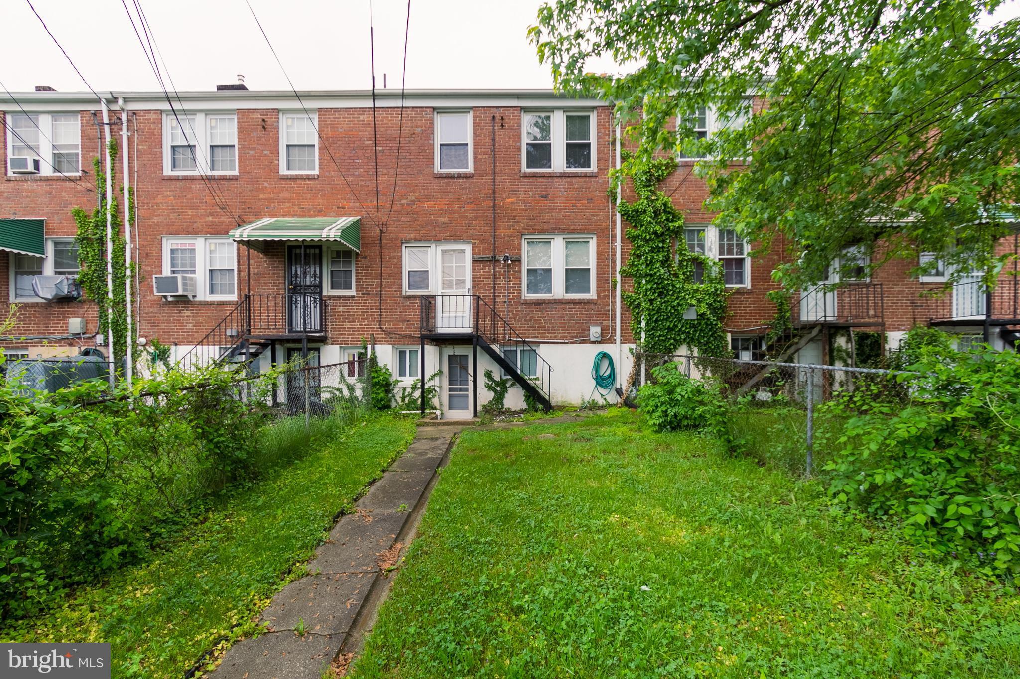 5228 Old Frederick Road Baltimore, MD 21229 - Photo 26 of 28 a aerial view of a house with a yard and sitting area