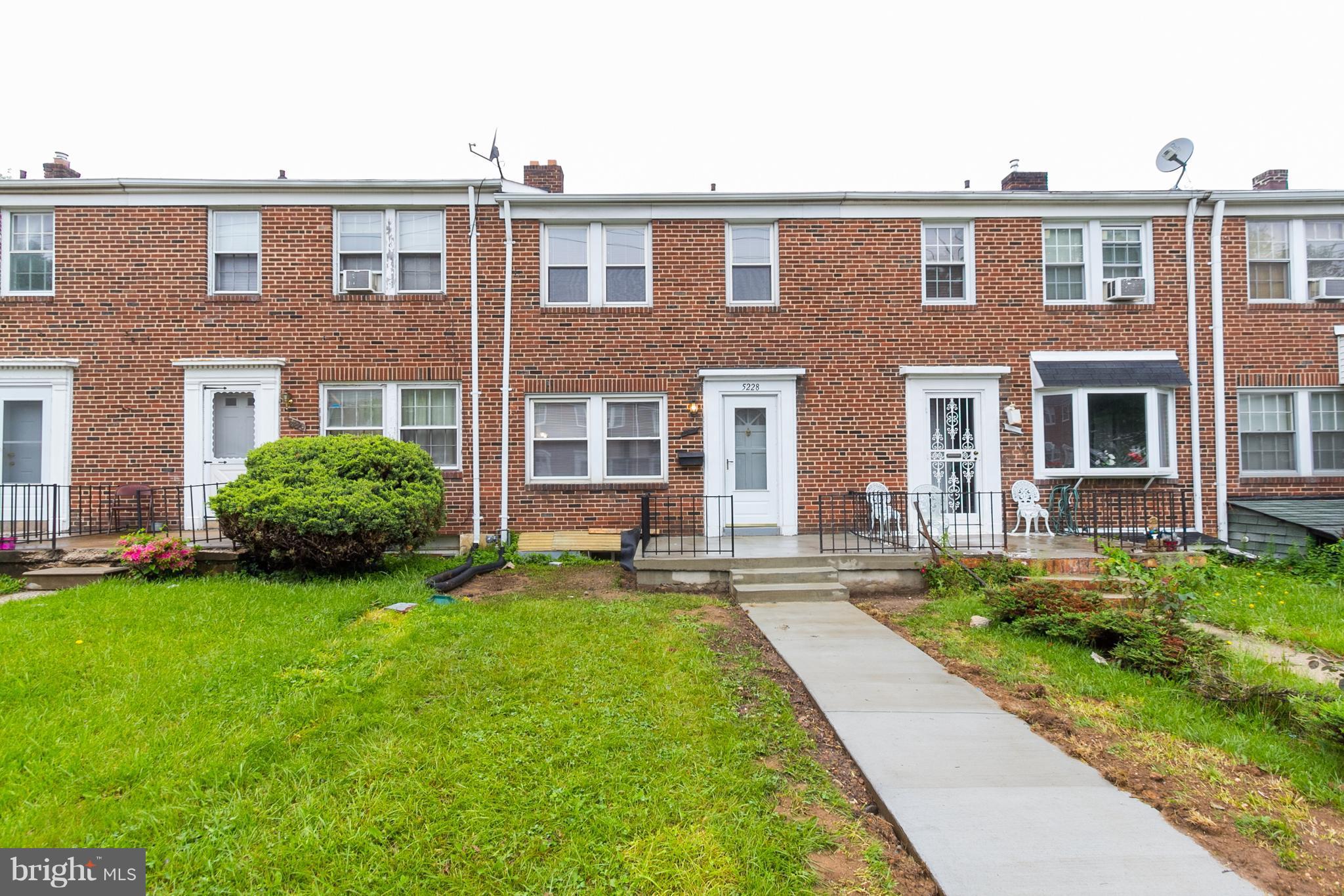 5228 Old Frederick Road Baltimore, MD 21229 - Photo 27 of 28 a front view of a house with a yard