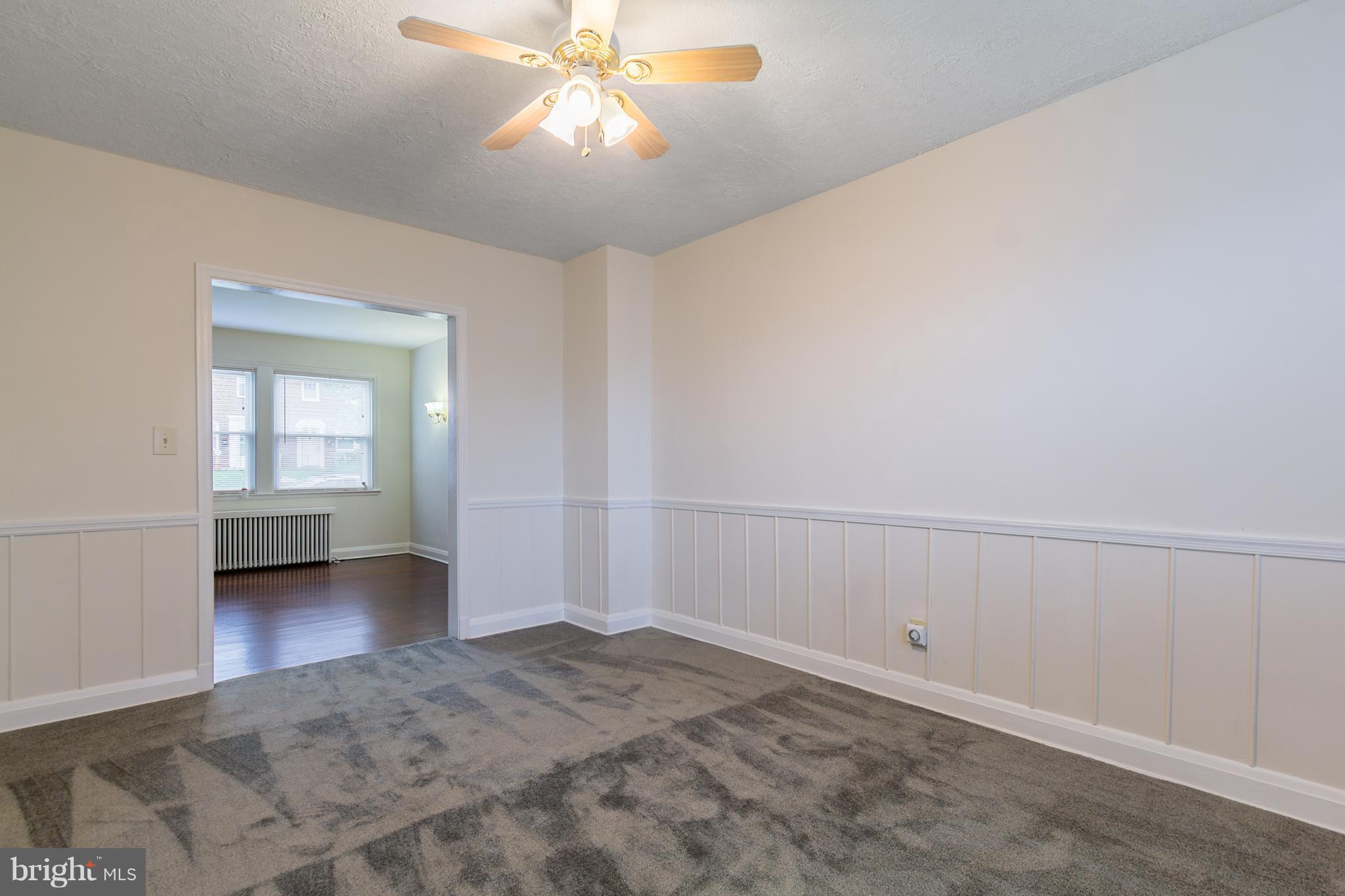 5228 Old Frederick Road Baltimore, MD 21229 - Photo 8 of 28 a view of a livingroom with a ceiling fan and window
