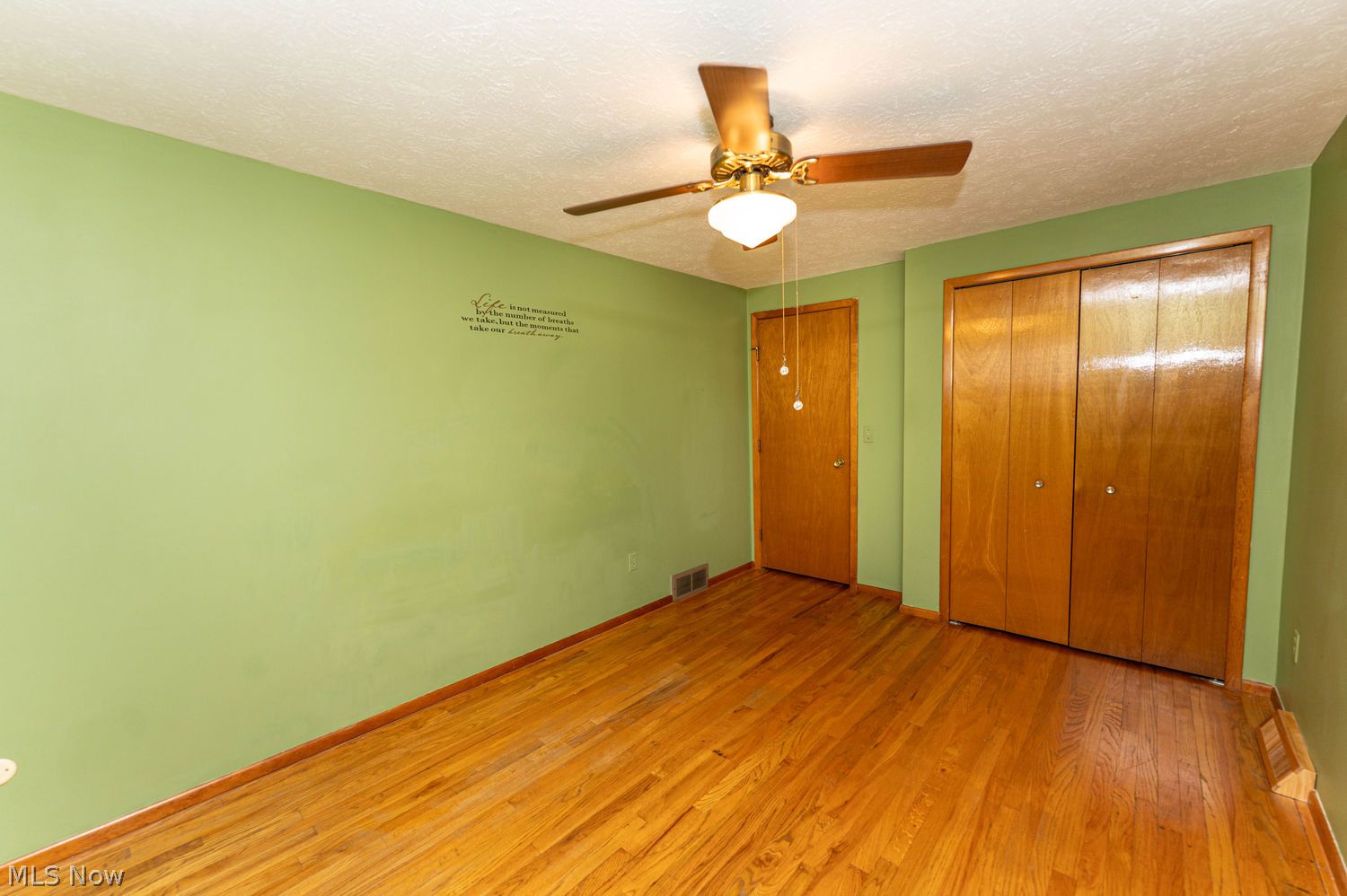 916 Center Road Eastlake, OH 44095 - Photo 18 of 39 Generously sized primary suite with beautiful hardwood floors