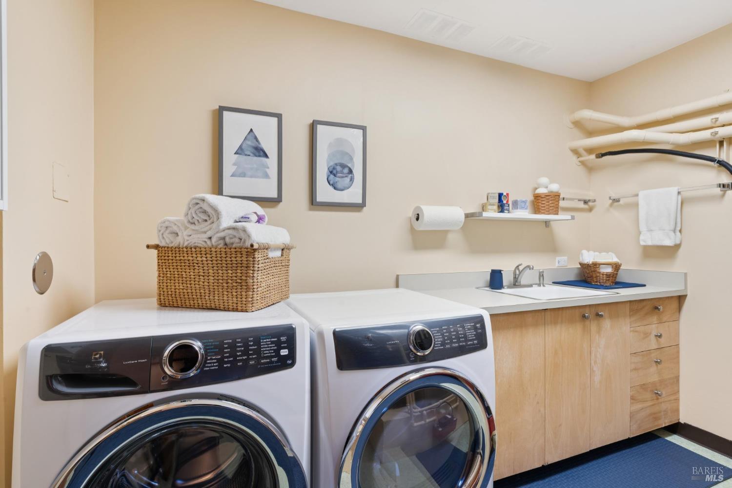 14 Oak Grove Way Napa, CA 94559 - Photo 43 of 56 a utility room with dryer washer and wooden floor