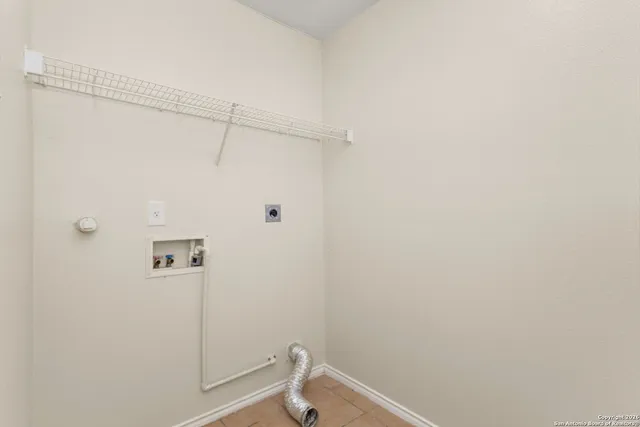 a bathroom with a granite countertop shower and a toilet