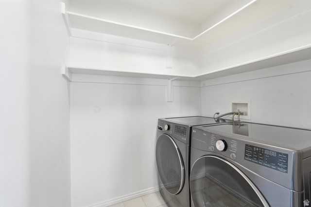 99 Penhurst Place Logan, UT 84341 - Photo 23 of 34 Dedicated laundry area featuring white shelving and baseboards