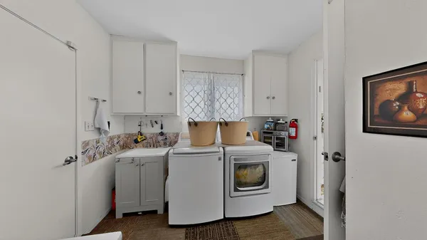 a utility room with dryer and washer