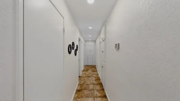 a view of a hallway with a door