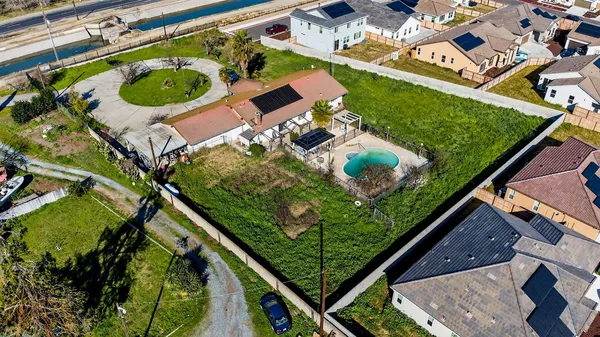 an aerial view of a house with a garden