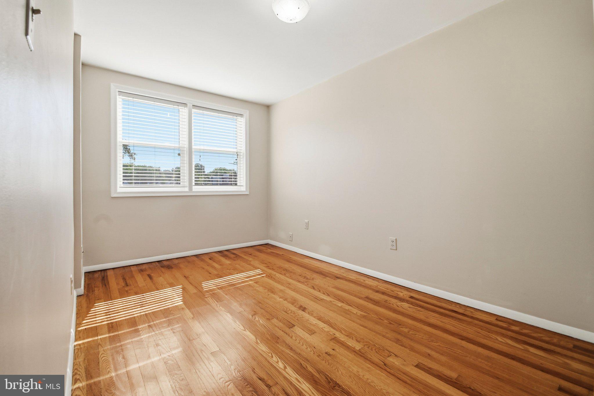 747 Old Riverside Road Baltimore, MD 21225 - Photo 15 of 26 Second Upstairs Bedroom with Natural Light