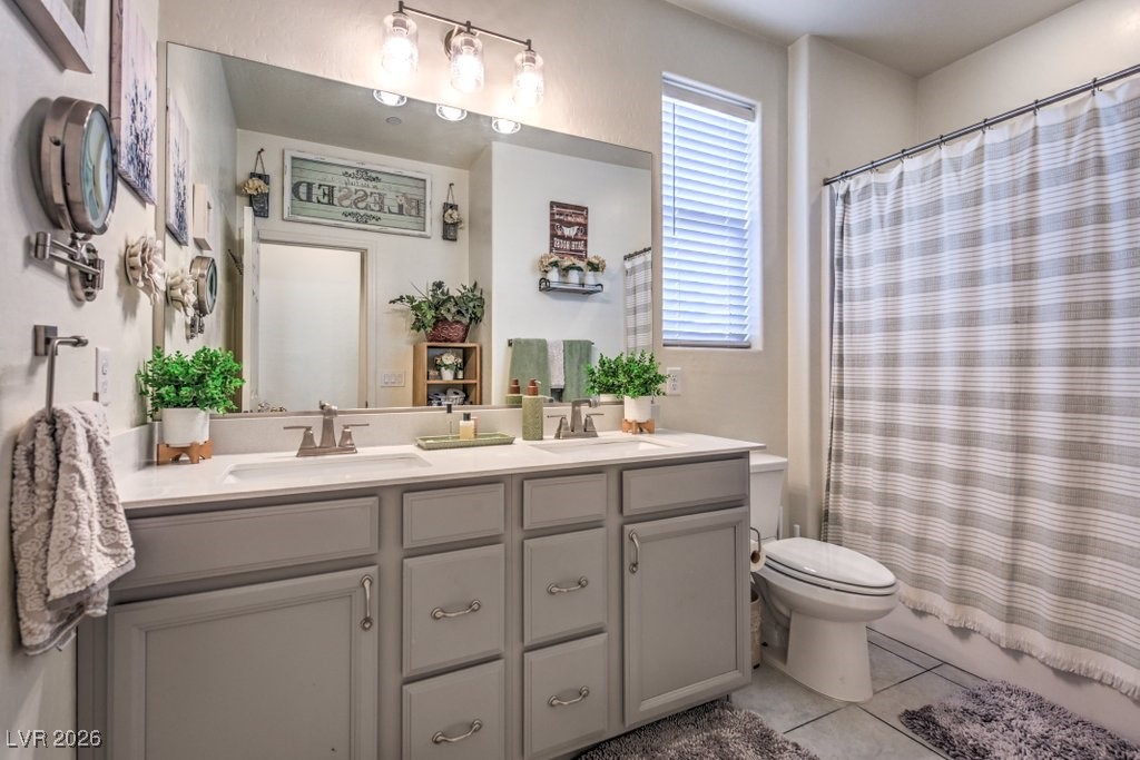 345 Silva Place Henderson, NV 89011 - Photo 30 of 68 The guest full bathroom is the ideal set up. You have a tub/shower combination, dual sinks, tile flooring and plenty of storage.