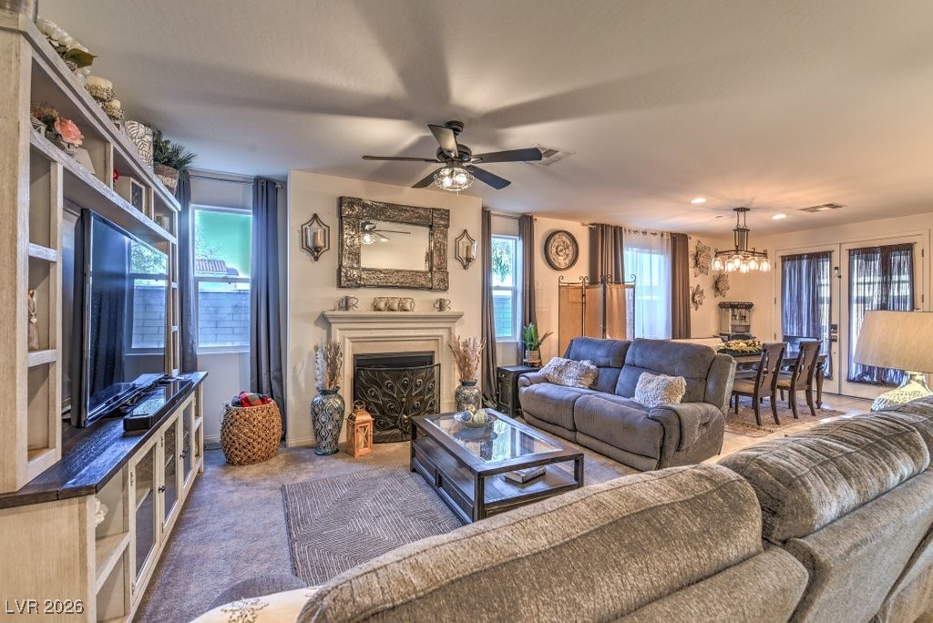 345 Silva Place Henderson, NV 89011 - Photo 7 of 68 The Great Room offers 10 foot ceilings! Gas fireplace with mantle. The Great Room offers views into the Dining area, Kitchen and Living Room space.