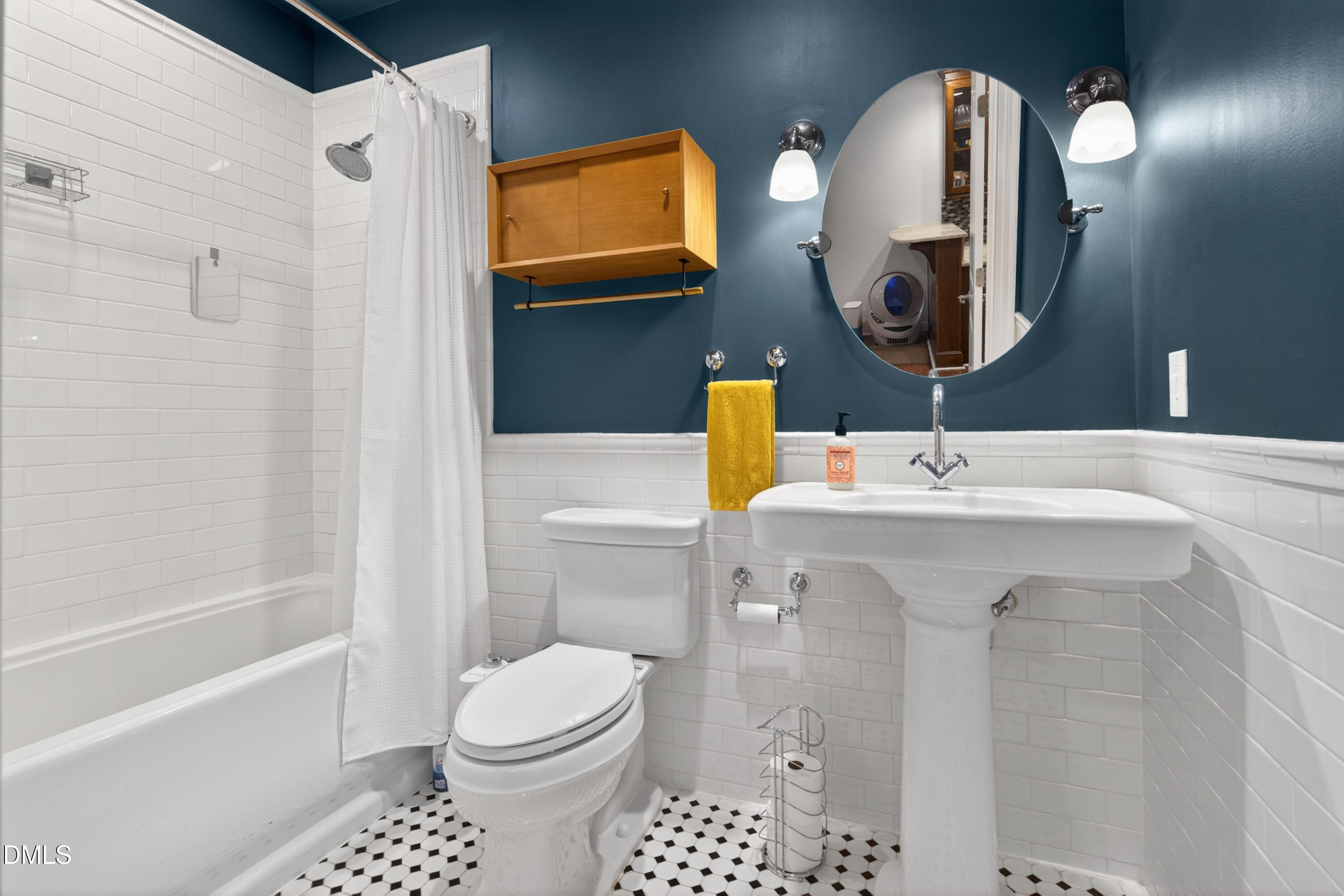710 Independence Place, Unit 104 Raleigh, NC 27603 - Photo 23 of 34 a bathroom with a sink a toilet and shower
