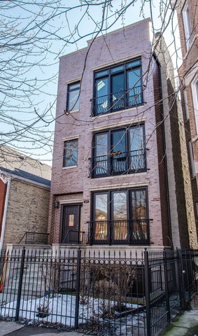 2629 West Haddon Avenue, Unit 2 Chicago, IL 60622 - Photo 1 of 8 a brick building that has lots of windows