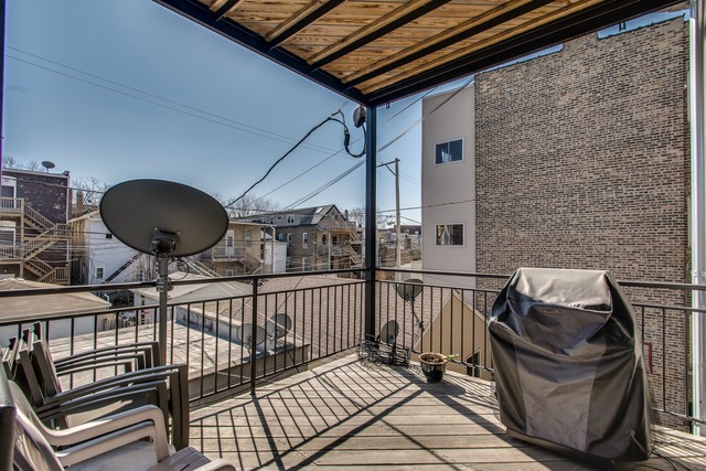2629 West Haddon Avenue, Unit 2 Chicago, IL 60622 - Photo 8 of 8 a view of balcony with wooden floor and outdoor seating