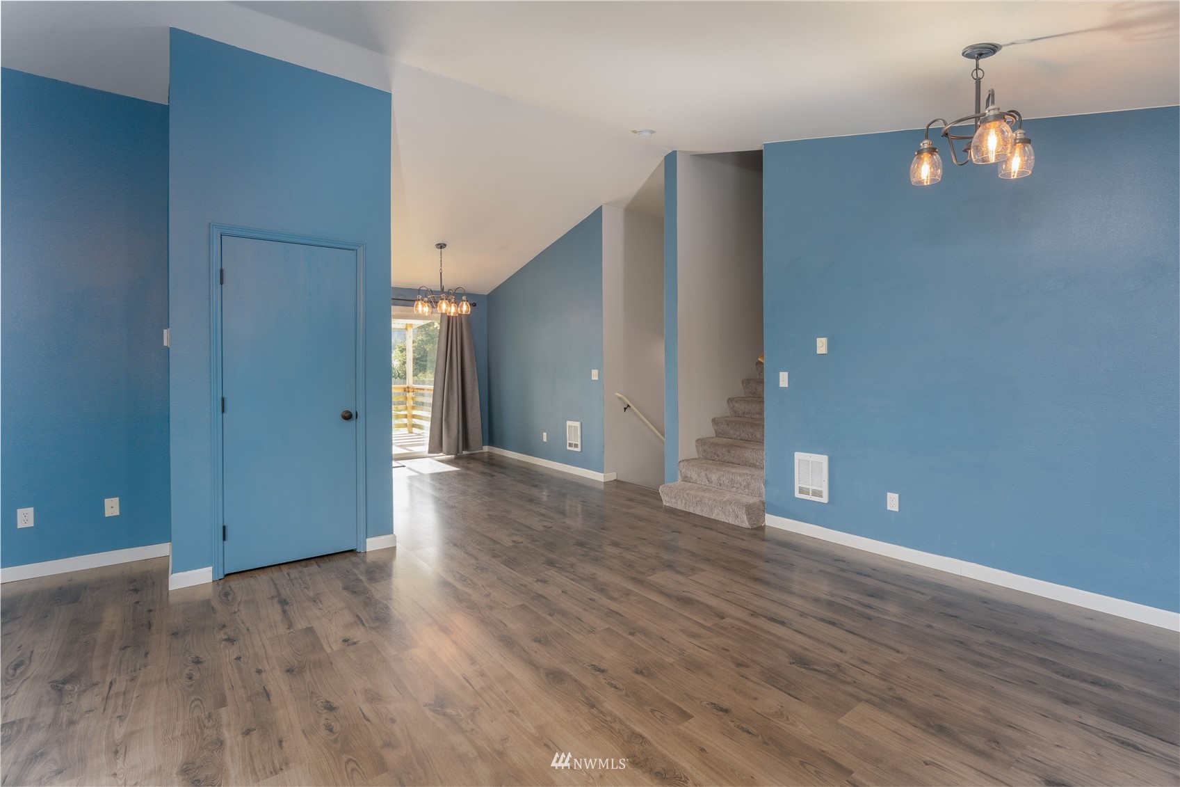 18726 Deerfield Lane Southwest Rochester, WA 98579 - Photo 12 of 27 a view of an empty room with wooden floor