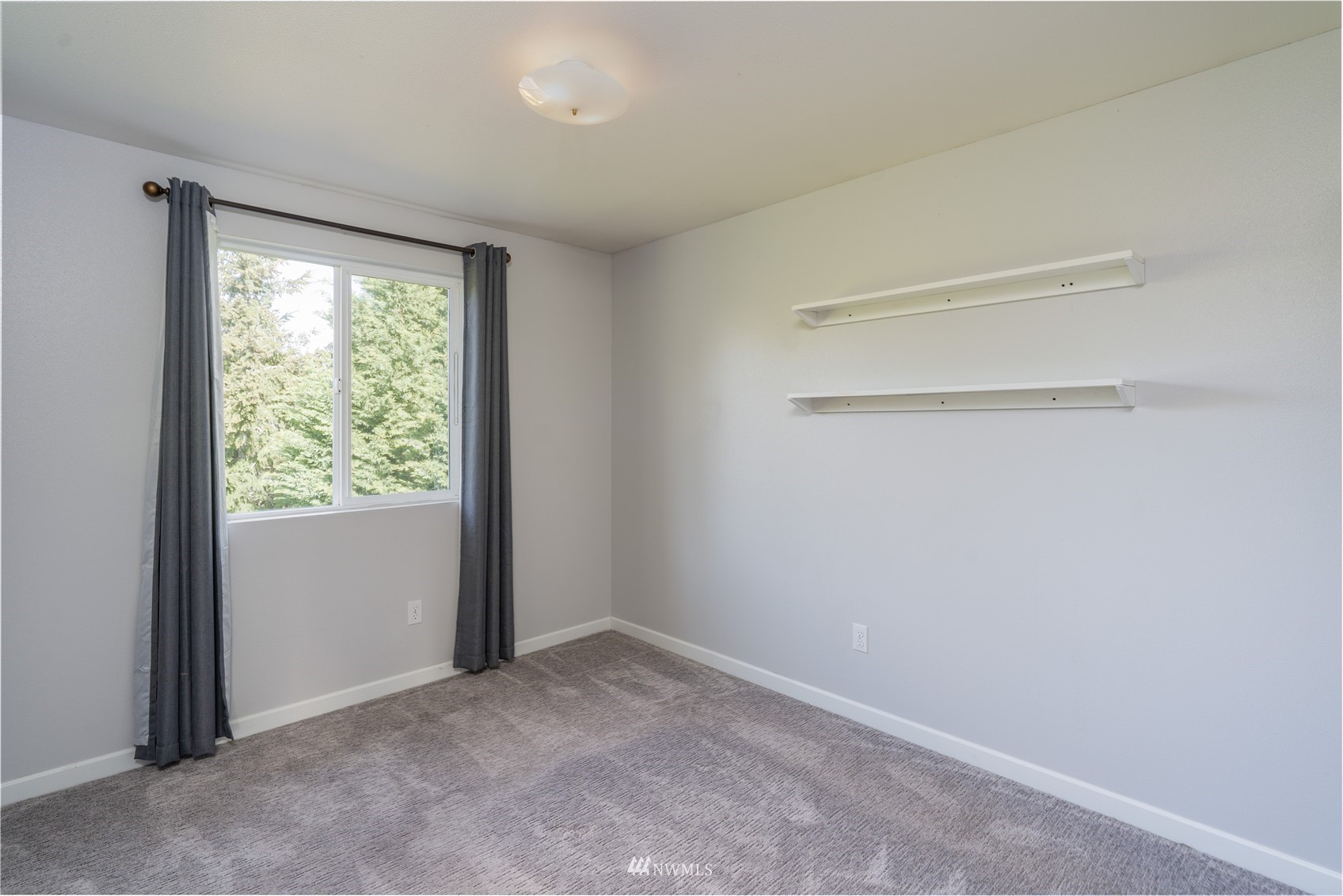 18726 Deerfield Lane Southwest Rochester, WA 98579 - Photo 19 of 27 a view of an empty room with a window