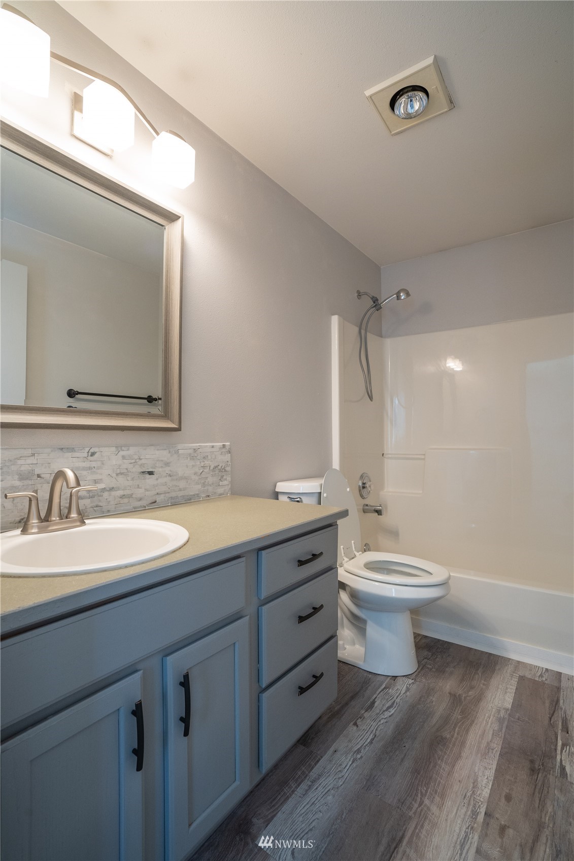 18726 Deerfield Lane Southwest Rochester, WA 98579 - Photo 24 of 27 a bathroom with a toilet sink and mirror